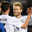 Germany's Andre Schuerrle (R) celebrates with Jonas Hector after scoring a goal against Azerbaijan on March 26, 2017