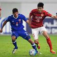 Zheng Wenzhao (C) of Guangzhou Evergrande competes for the ball with Josh Mitchell of Eastern FC during their AFC Champions League group stage football match in Guangzhou, China, on February 22, 2017
