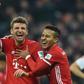 Bayern Munich's striker Thomas Mueller (L) and midfielder Thiago Alcantara celebrate on December 10, 2016