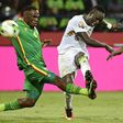 Senegal's forward Sadio Mane (R) kicks the ball past Zimbabwe's defender Onismor Bhasera during the 2017 Africa Cup of Nations group B football match January 19, 2017