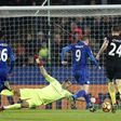 Leicester City's Jamie Vardy (2nd R) takes the ball around Manchester City's goalkeeper Claudio Bravo on his way to scoring their third goal on December 10, 2016