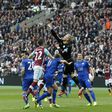 Leicester City's Kasper Schmeichel punches the ball away during the match against West Ham The London Stadium