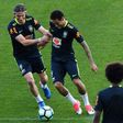 Brazil's Filipe Luis (L) and Neymar take part in a training session at the Arena Corinthians stadium in Sao Paulo, on March 26, 2017, ahead of their Russia 2018 World Cup qualifier against Paraguay