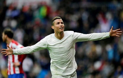 Real Madrid's forward Cristiano Ronaldo celebrates his second goal during the Spanish league football match against Real Sporting de Gijon November 26, 2016