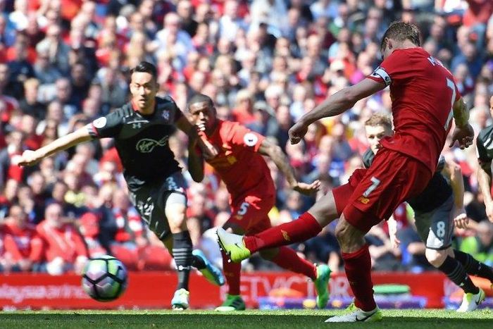 Liverpool's midfielder James Milner takes a penalty during the English Premier League football match between Liverpool and Southampton at Anfield in Liverpool, north west England on May 7, 2017