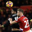 Chelsea's striker Diego Costa (L) vies in the air with Middlesbrough's defender Calum Chambers during the English Premier League football match November 20, 2016