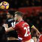 Chelsea's striker Diego Costa (L) vies in the air with Middlesbrough's defender Calum Chambers during the English Premier League football match November 20, 2016