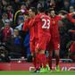 Liverpool's midfielder Roberto Firmino (L) celebrates with teammates after scoring the opening goal of the English Premier League football match against Arsenal March 4, 2017