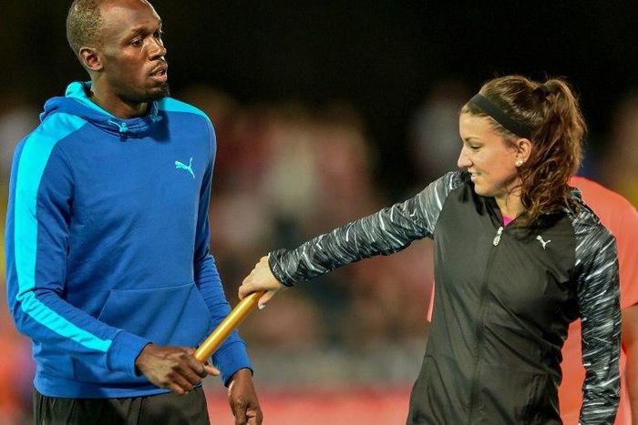 Bolt All Stars Captain Usain Bolt of Jamaica practices the baton exchange with his teammate Jenna Prandini of the US before their Mixed 4x100m relay event at the Nitro Athletics meet in Melbourne, on February 4, 2017