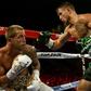 Jason Sosa (L) of the US exchanges punches with Vasyl Lomachenko of Ukraine during their WBO super featherweight world championship bout, at MGM National Harbor in Oxon Hill, Maryland, on April 8, 2017