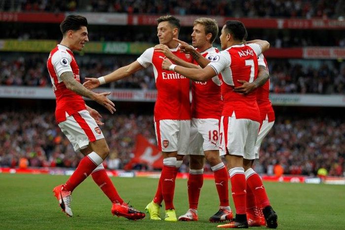 Arsenal's defender Hector Bellerin (L), seen celebrating a goal with teammates in September 2016, said he is "really, really happy" to have his contract extended with the English team