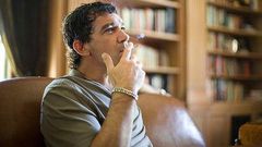Antonio Banderas smoking a cigarette.