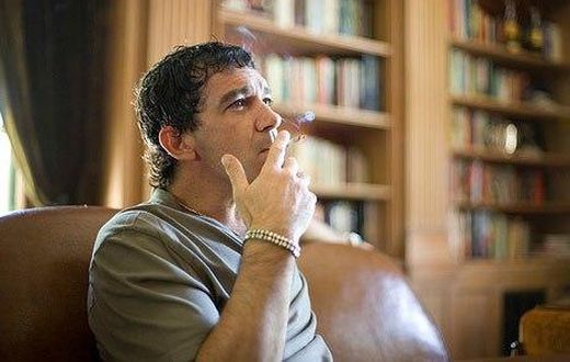 Antonio Banderas smoking a cigarette.