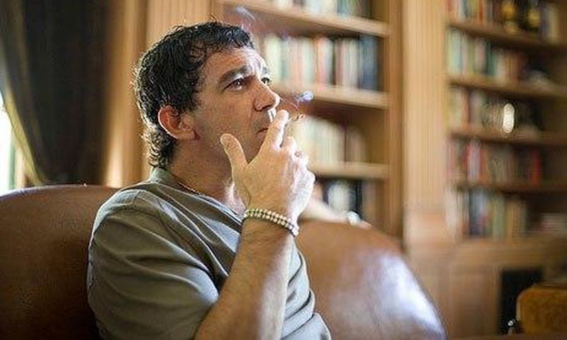 Antonio Banderas smoking a cigarette.