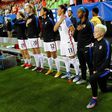 Megan Rapinoe (R) kneels during the National Anthem prior to a match in 2016