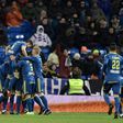 Celta Vigo players celebrate after scoring their second goal during their Spanish Copa del Rey quarter-final first leg against Real Madrid at the Santiago Bernabeu stadium in Madrid on January 18, 2017