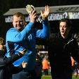 Sutton United's reserve goalkeeper Wayne Shaw (C) applauds supporters after the club's FA Cup fifth round defeat to Arsenal at the Borough Sports Ground, Gander Green Lane in south London on February 20, 2017