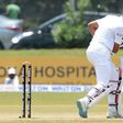 Bangladesh batsman Mahmudullah Riyad looks back at his shattered wicket after his dismissal by Sri Lankan bowler Lahiru Kumara during the first Test against Sri Lanka in Galle on March 9, 2017