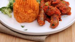 Mashed sweet potatoes and sausages cooked in tomato sauce (Foodace)