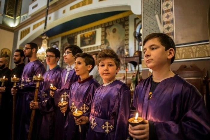 Egyptian Christians observe a solemn Good Friday at the Archangels Greek Orthodox Church in the capital Cairo, on April 14, 2017, as the community reels from deadly church bombings