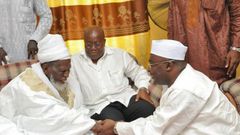 Nana Akufo-Addo with his running mate and the Chief Imam
