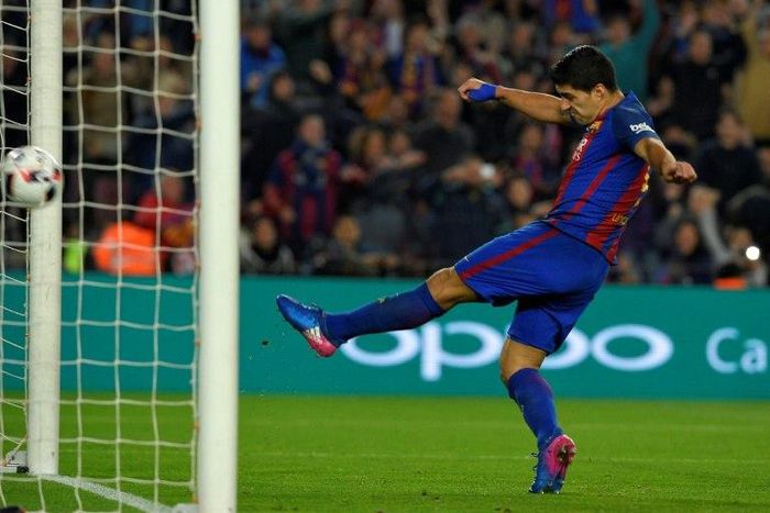 Barcelona's Luis Suarez scores a cancelled goal during the Spanish Copa del Rey semi final match against Club Atletico de Madrid in Barcelona on February 7, 2017