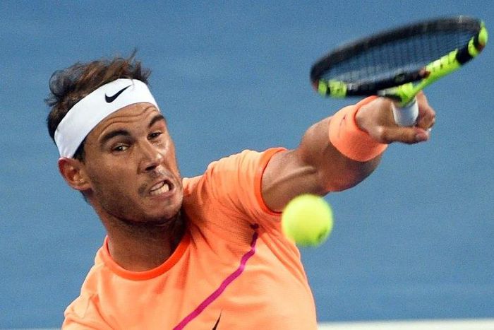 Spain's Rafael Nadal serves against Alexandr Dolgopolov of Ukraine at the Brisbane International on January 3, 2017