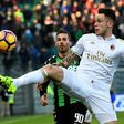 AC Milan's forward Lucas Ocampos controls the ball over Sassuolo's forward Antonino Ragusa (rear) during the Italian Serie A match Sassuolo vs AC Milan at the Mapei stadium in Reggio Emilia on February 26, 2017
