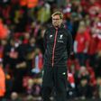 Liverpool manager Jurgen Klopp watches his players warm up before their Premier League match against Manchester United at Anfield on October 17, 2016