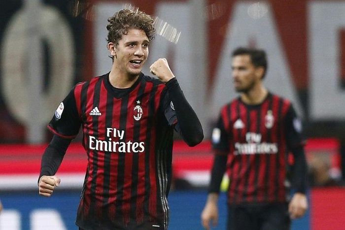AC Milan's midfielder Manuel Locatelli celebrates after scoring (L) during the Italian Serie A football match AC Milan versus Juventus on October 22, 2016