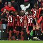 Bournemouth celebrate their fourth goal, which sealed a 4-3 win against Liverpool in Bournemouth on December 4, 2016