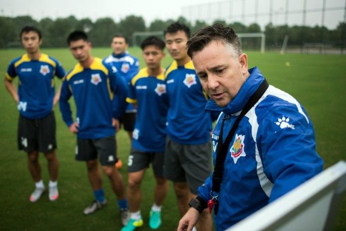 Gary White (R) has his eye on winning promotion to the Chinese Super League next season after saving Shanghai Shenxin from relegation