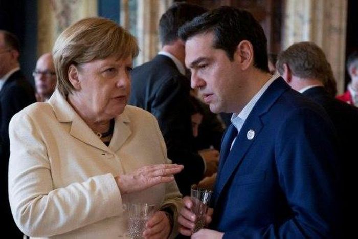 German Chancellor Angela Merkel speaks with Greek Prime Minister Alexis Tsipras during the 60th anniversary of the Traety of Rome, on March 25, 2017