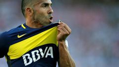 Boca Juniors' forward Carlos Tevez celebrates after scoring on December 11, 2016