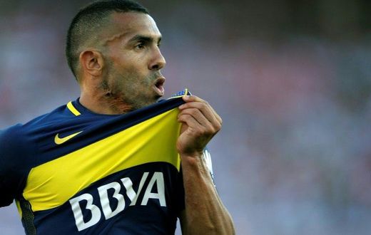 Boca Juniors' forward Carlos Tevez celebrates after scoring on December 11, 2016