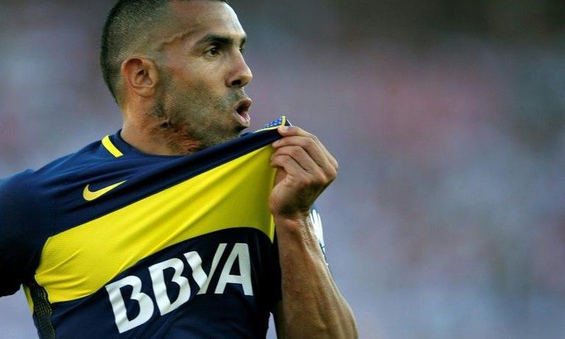 Boca Juniors' forward Carlos Tevez celebrates after scoring on December 11, 2016