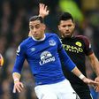 Everton defender Ramiro Funes Mori (L) vies with Manchester City striker Sergio Aguero during the English Premier League match at Goodison Park in Liverpool, north-west England on January 15, 2017