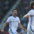 Chelsea's Marcos Alonso (R) celebrates scoring their third goal from a free kick during their match against Bournemouth at the Vitality Stadium in Bournemouth, southern England on April 8, 2017