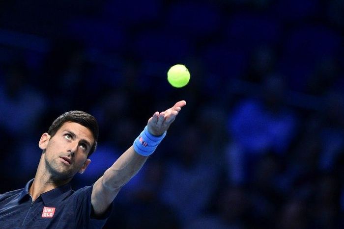 Serbia's Novak Djokovic serves to Belgium's David Goffin during their group match at the ATP World Tour Finals in London on November 17, 2016