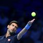 Serbia's Novak Djokovic serves to Belgium's David Goffin during their group match at the ATP World Tour Finals in London on November 17, 2016