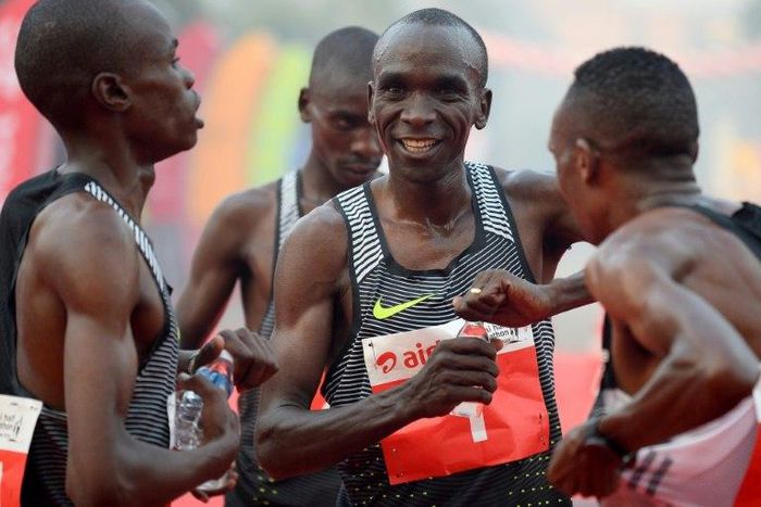 Kenyan Olympic gold medallist marathon runner Eliud Kipchoge (C) is one of three top runners selected by Nike to make the marathon record attempt later this year