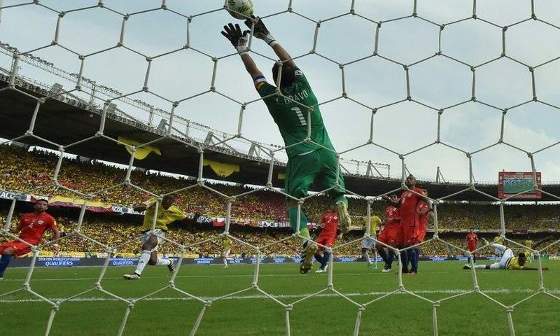Chile's goalkeeper Claudio Bravo pulls off a save during the 2018 FIFA World Cup qualifier football match against Colombia in Barranquilla, Colombia, on November 10, 2016