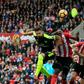 Arsenal's French striker Olivier Giroud heads the ball to score their third goal during the English Premier League football match between Sunderland and Arsenal at the Stadium of Light in Sunderland, northeast England on October 29, 2016