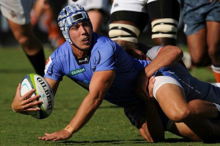 Luke Burton of Australia's Western Force is tackled during a Super Rugby match against South Africa's Southern Kings in Perth on April 9, 2017. Force or the Melbourne Rebels face the axe from next year's revamped Super Rugby competition