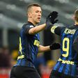 Inter Milan's Argentina Mauro Icardi (R) celebrates with teammate Ivan Perisic after scoring a goal against Chievo in Milan on January 14 , 2017