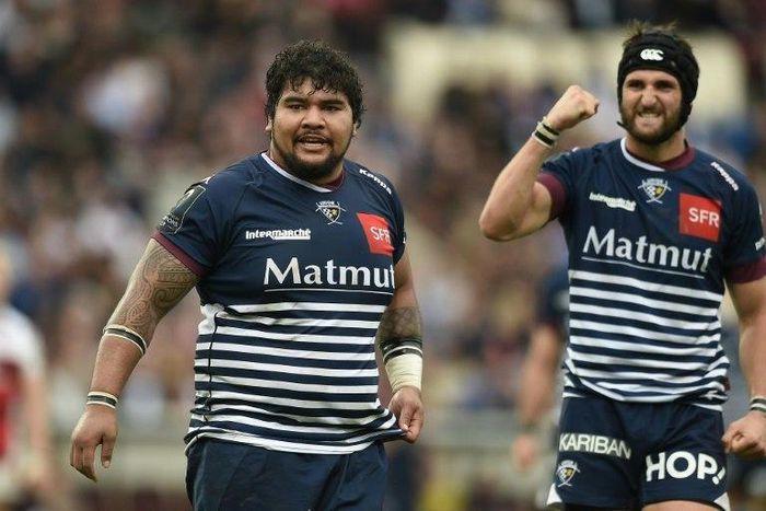 Bordeaux prop Sebastien Taofifenua (L) reacts after scoring a try on October 16, 2016