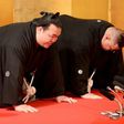 Accompanied by stable master Tagonoura (R) and Tagonoura's wife, sumo wrestler Kisenosato meets with representatives from the Japan Sumo Association, in Tokyo, on January 25, 2017
