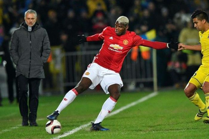 Manchester United manager Jose Mourinho (left) looks at Paul Pogba (centre) in action against Rostov during an UEFA Europa League match in Rostov-on-Don, on March 9, 2017