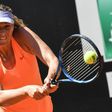 Russia's tennis player Maria Sharapova hits a return to US tennis player Christina McHale on May 15, 2017