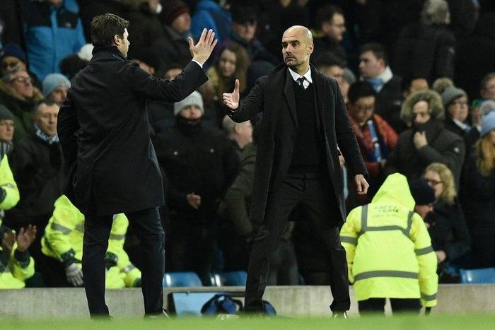 Tottenham Hotspur's head coach Mauricio Pochettino (L) shakes hands with Manchester City's manager Pep Guardiola on January 21, 2017